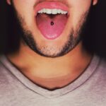 Are oral piercings bad for your teeth?